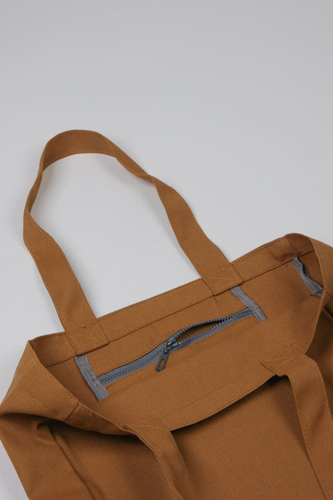 Tan canvas tote bag inner pocket detail