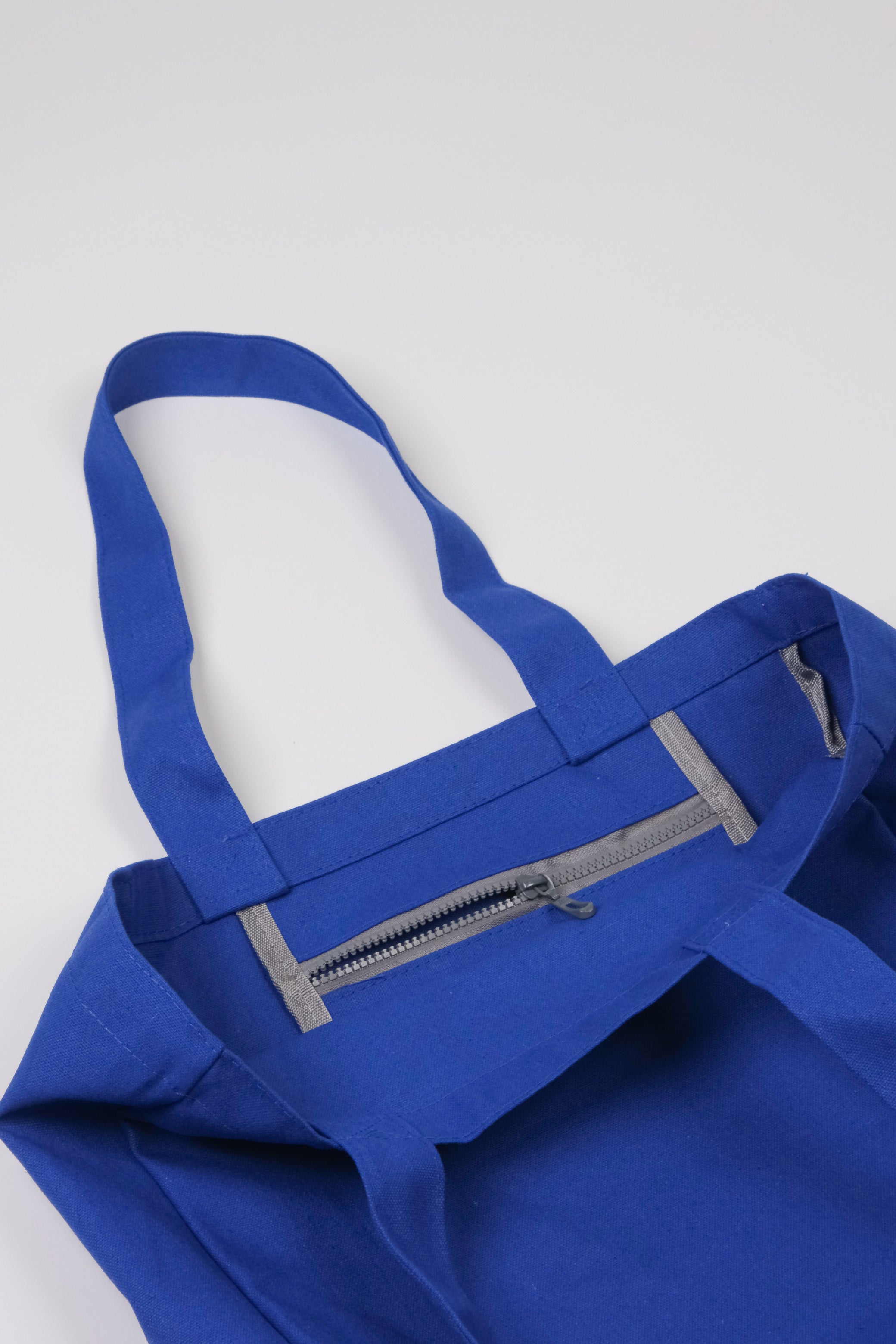 Bright blue tote inner zip detail