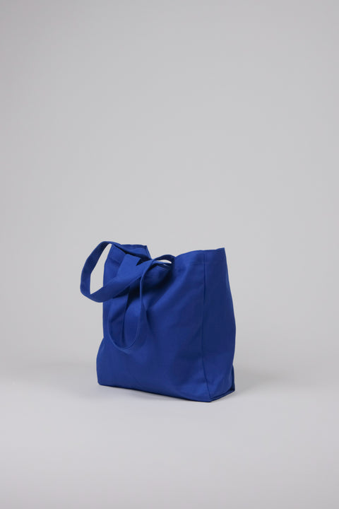 Bright blue tote side view of gusset