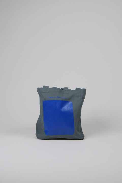 Swim in the ocean blue tote bag front view