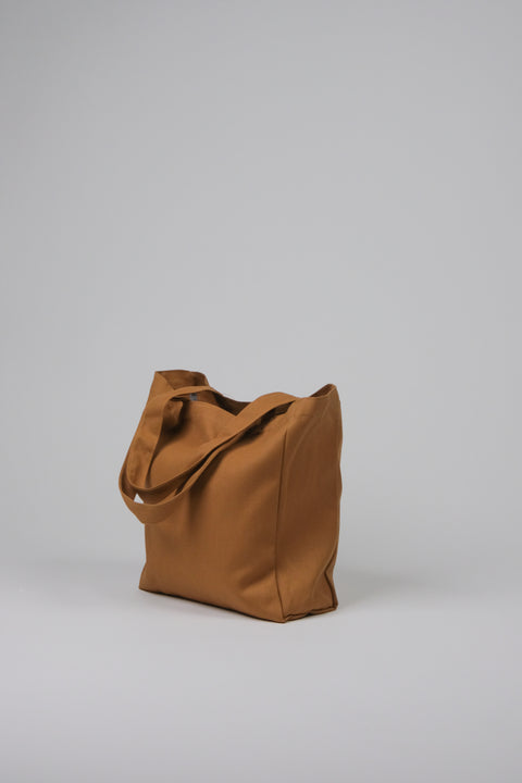 Tan canvas tote bag side view